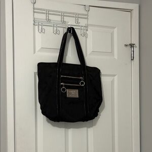 Coach black cloth handbag purse with 2 outside zippered pockets